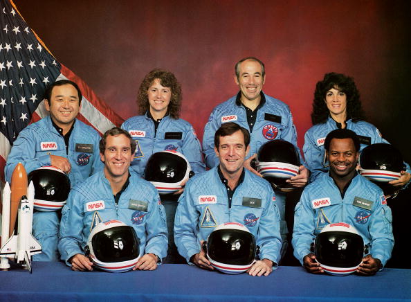 circa 1985: The crew of the disastrous STS 51-L mission: (back row, left to right) Ellison S Onizuka, Sharon Christa McAuliffe, Gregory B Jarvis, Judith A Resnik, (front row, left to right) Michael J Smith, Francis R Scobee and Ronald E McNair. All seven were killed when the Challenger shuttle exploded during take-off on 28th January 1986. (Photo by NASA/Space Frontiers/Getty Images)