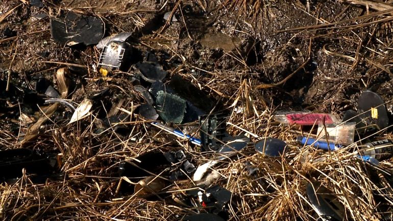 One day after a two Lee's Summit teens were killed in a crash and another was injured, debris from the accident remains along the roadway. A fourth person in a separate vehicle was also injured in the crash, but police say those injuries are minor.