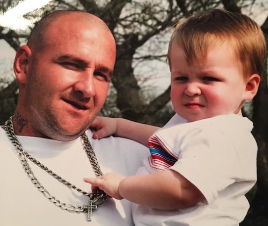 A provided photo of Mike Capps with one of his children. 