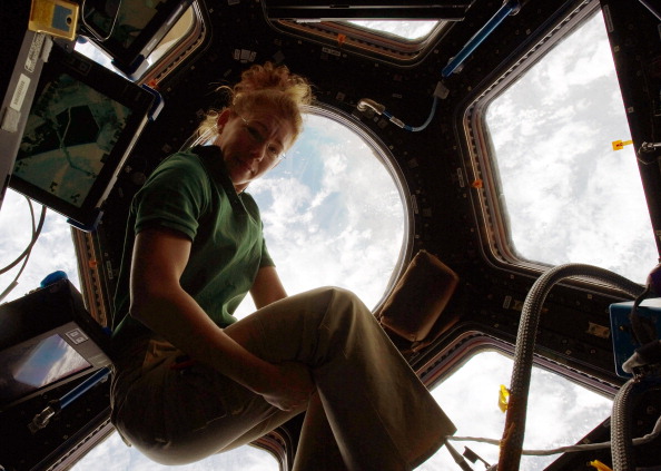 IN SPACE - JULY 18: In this handout image provided by the National Aeronautics and Space Administration (NASA), NASA astronaut Sandy Magnus, STS-135 mission specialist, gets one last visit to the Cupola onboard the International Space Station before the two spacecraft undocked July 18, 2011 in space. Space shuttle Atlantis is on the last leg of a 12-day mission to the International Space Station where it delivered the Raffaello multi-purpose logistics module packed with supplies and spare parts. This was the final mission of the space shuttle program, which began on April 12, 1981 with the launch of Colombia. (Photo by NASA via Getty Images)