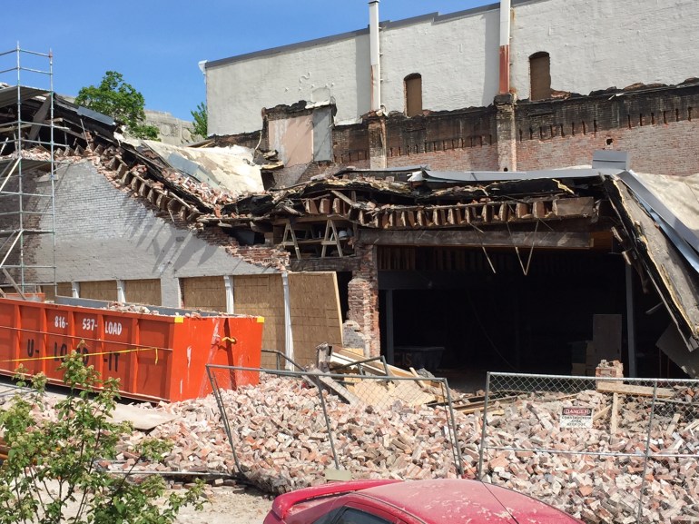 The old Ethan Allen building on the Liberty Square collapsed on Tuesday.