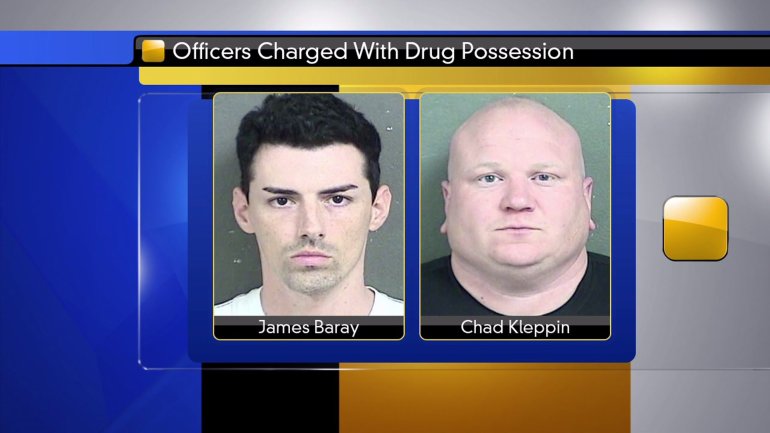 Officers charged with drug possession