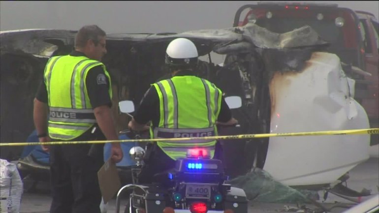 Police are looking into what caused the car to hit a pole then overturn.
