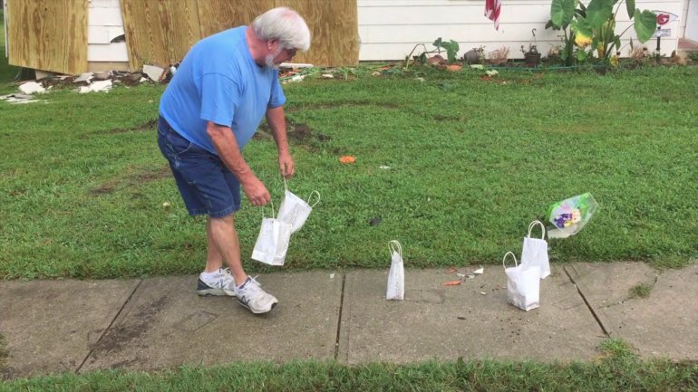 Harrisonville residents deliver flowers and candles to the scene of the crash.