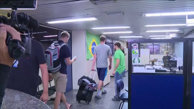U.S. swimmers were escorted from the airport to police unit. Courtesy: AP