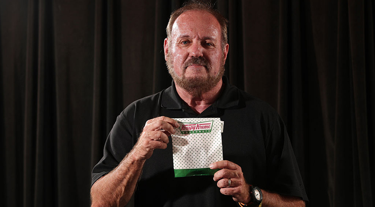 Daniel Rushing poses with the Krispy Kreme donut he purchases every other Wednesday on Wednesday, July 27, 2016 in Orlando, Fla. Rushing, 64, a retired city employee, had just left a 7-Eleven on West Colonial Drive when an Orlando police officer pulled him over. When she looked inside the car, Officer Shelby Riggs-Hopkins spotted something suspicious on the floorboard - pieces of a "rock-like" substance. She conducted a field drug test. The results: methamphetamine. She handcuffed Rushing and took him to jail. It turned out the "methamphetamine" were pieces of glaze that had fallen off a Krispie Kreme Doughnut. (Ricardo Ramirez Buxeda/Orlando Sentinel/TNS via Getty Images)