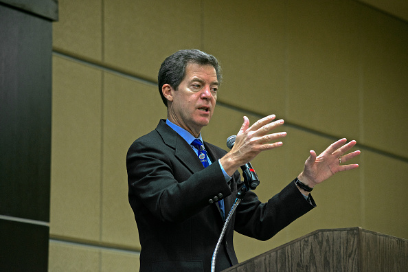 Emporia, Kansas 10-8-2014 Governor Sam Brownback at the Kansas Economic Development Assocition luncheon today at Emporia State University. Republican Governor Brownback who is trailing in the pols against his rival Democratic challenger Paul Davis says his campaign is surging. Credit: Mark Reinstein (Photo by Mark Reinstein/Corbis via Getty Images)