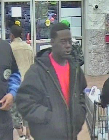 Police are searching for a suspect in a robbery that took place in a Walmart parking lot in November.
