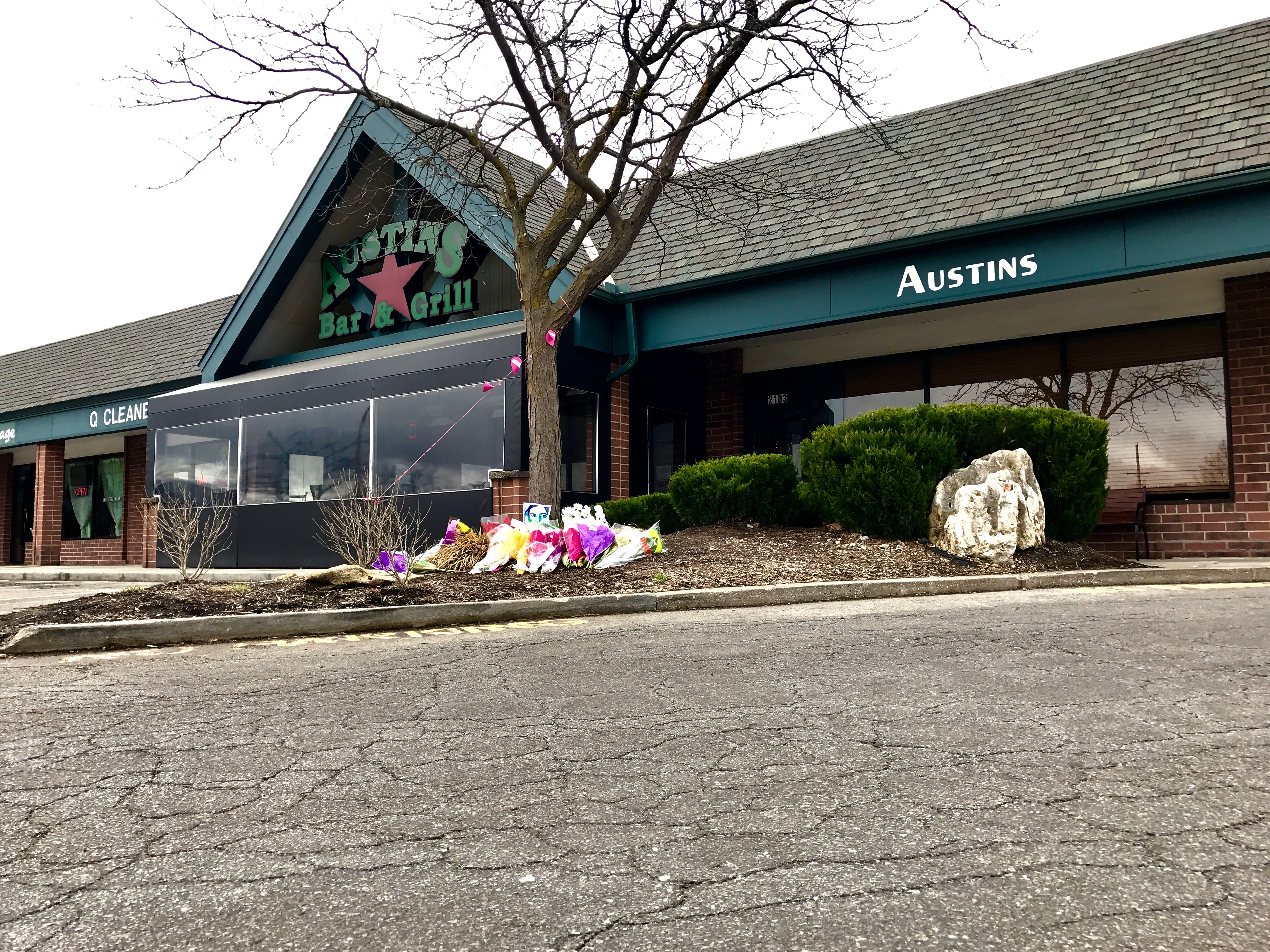 A memorial for the shooting victims was growing outside of Austins Bar and Grill Friday.