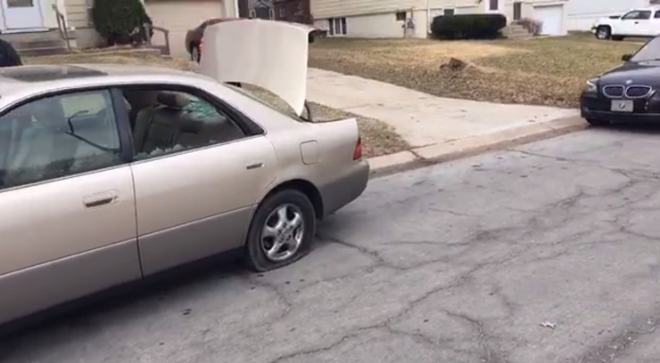 Windows and tires were shot out along the street.