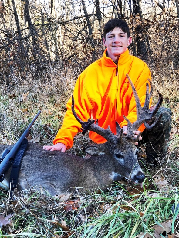 Missouri hunter with antlered female doe picture