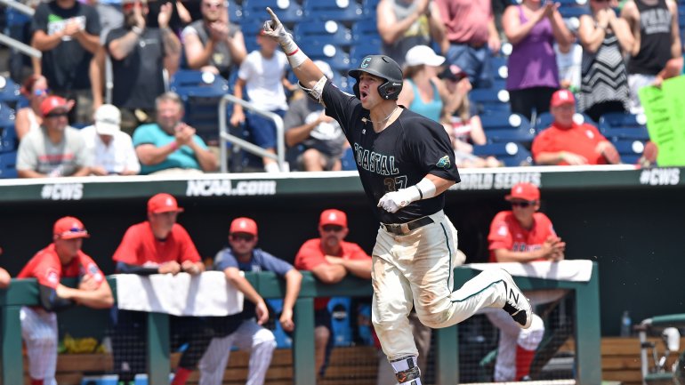 Batter G.K. Young, #37 of the Coastal Carolina Chanticleers, reacts after hitting a two-run home run against the Arizona Wildcats in the sixth inning during game three of the College World Series Championship Series on June 30, 2016, at TD Ameritrade Park in Omaha, Nebraska.  (Photo by Peter Aiken/Getty Images)