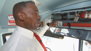 Coachella Valley school district superintendent Darryl Adams points out the router on a school bus, which helps his students have Wi-Fi access outside of school.