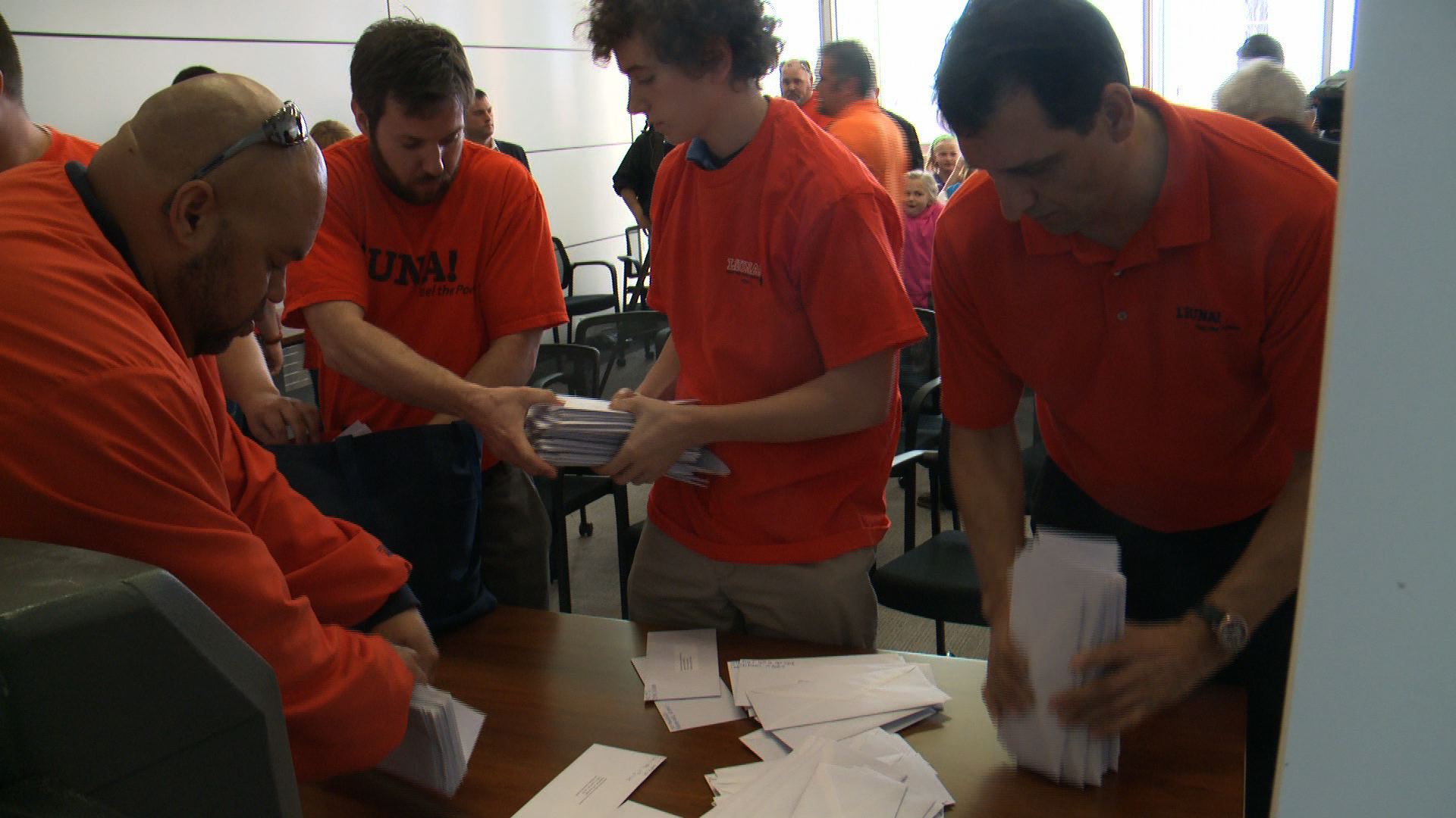 Members of LiUNA pack letters to deliver to the Iowa Utilities Board (Roger Riley WHO-HD)