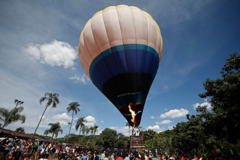 CORUMBA DE GOIAS, BRAZIL - MAY 04: The Olympic Torch is taken up in a hot air balloon during Day 2 of the Olympic Flame torch relay on May 4, 2016 in Corumba de Goias, Brazil. The Olympic torch will pass through 329 cities from all states from the north to the south of Brazil, until arriving in Rio de Janeiro on August 5, to lit the cauldron.