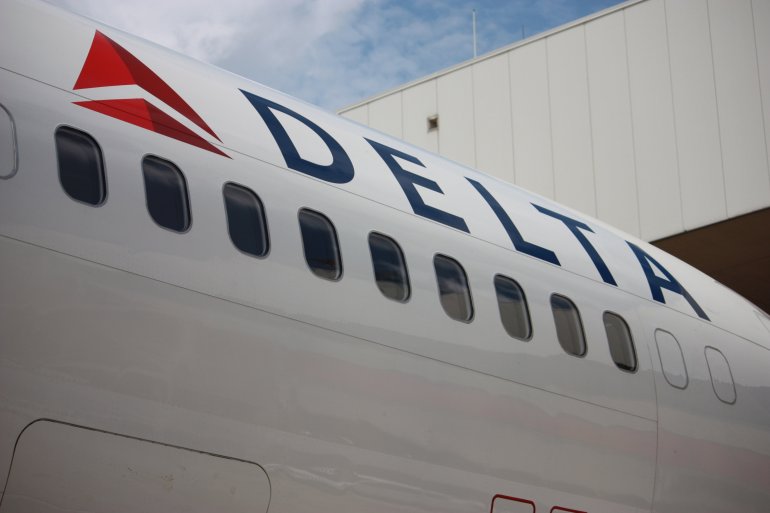 [FILE] A Delta Airlines jet sits on the tarmac at the Atlanta Hartsfield-Jackson International Airport.