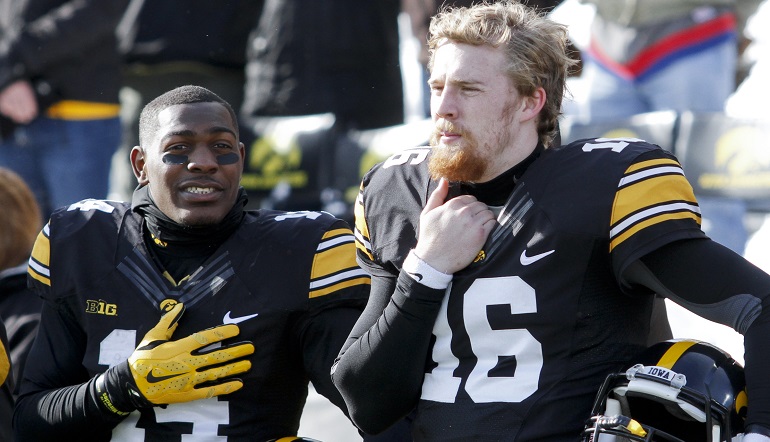 IOWA CITY, IA - NOVEMBER 21: Defensive back Desmond King #14 and quarterback C.J. Beathard #16 of the Iowa Hawkeyes stand before the match-up against the Purdue Boilermakers on November 21, 2015 at Kinnick Stadium, in Iowa City, Iowa. (Photo by Matthew Holst/Getty Images)