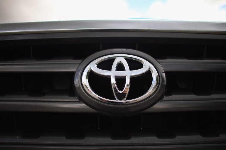 MIAMI, FL - OCTOBER 10: The Toyota emblem is seen on the grill of a 2008 Toyota Highlander as it sits on the Affordable Motors sales lot on October 10, 2012 in Miami, Florida. The 2008 Highlander is one of 7.43 million that Toyota says it is recalling globally for a faulty power-window switch that may stop working or catch fire in more than a dozen models that include the Yaris, RAV4, Tundra, Camry, Camry Hybrid, Scion xD, Scion xA, Sequoia, Highlander, Highlander Hybrid, Corolla and the Matrix produced from 2005 through 2010. (Photo by Joe Raedle/Getty Images)