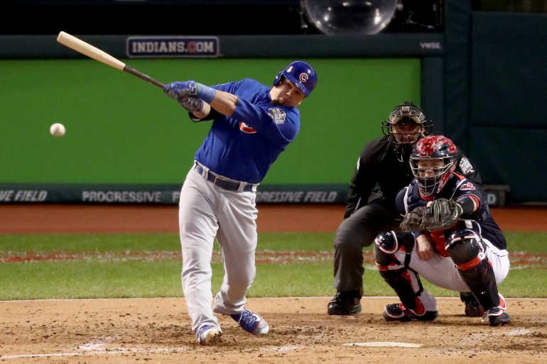 CLEVELAND, OH - OCTOBER 26: Kyle Schwarber #12 of the Chicago Cubs hits an RBI single to score Anthony Rizzo #44 (not pictured) during the third inning against the Cleveland Indians in Game Two of the 2016 World Series at Progressive Field on October 26, 2016 in Cleveland, Ohio. (Photo by Elsa/Getty Images)