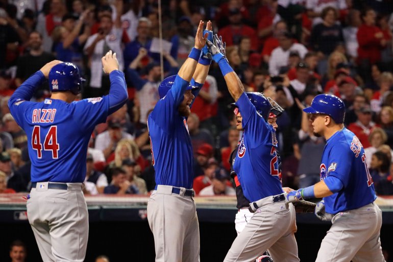 CLEVELAND, OH - NOVEMBER 01: Addison Russell #27 of the Chicago Cubs celebrates with Anthony Rizzo #44, Ben Zobrist #18 and Kyle Schwarber #12 after hitting a grand slam home run during the third inning against the Cleveland Indians in Game Six of the 2016 World Series at Progressive Field on November 1, 2016 in Cleveland, Ohio. (Photo by Jamie Squire/Getty Images)