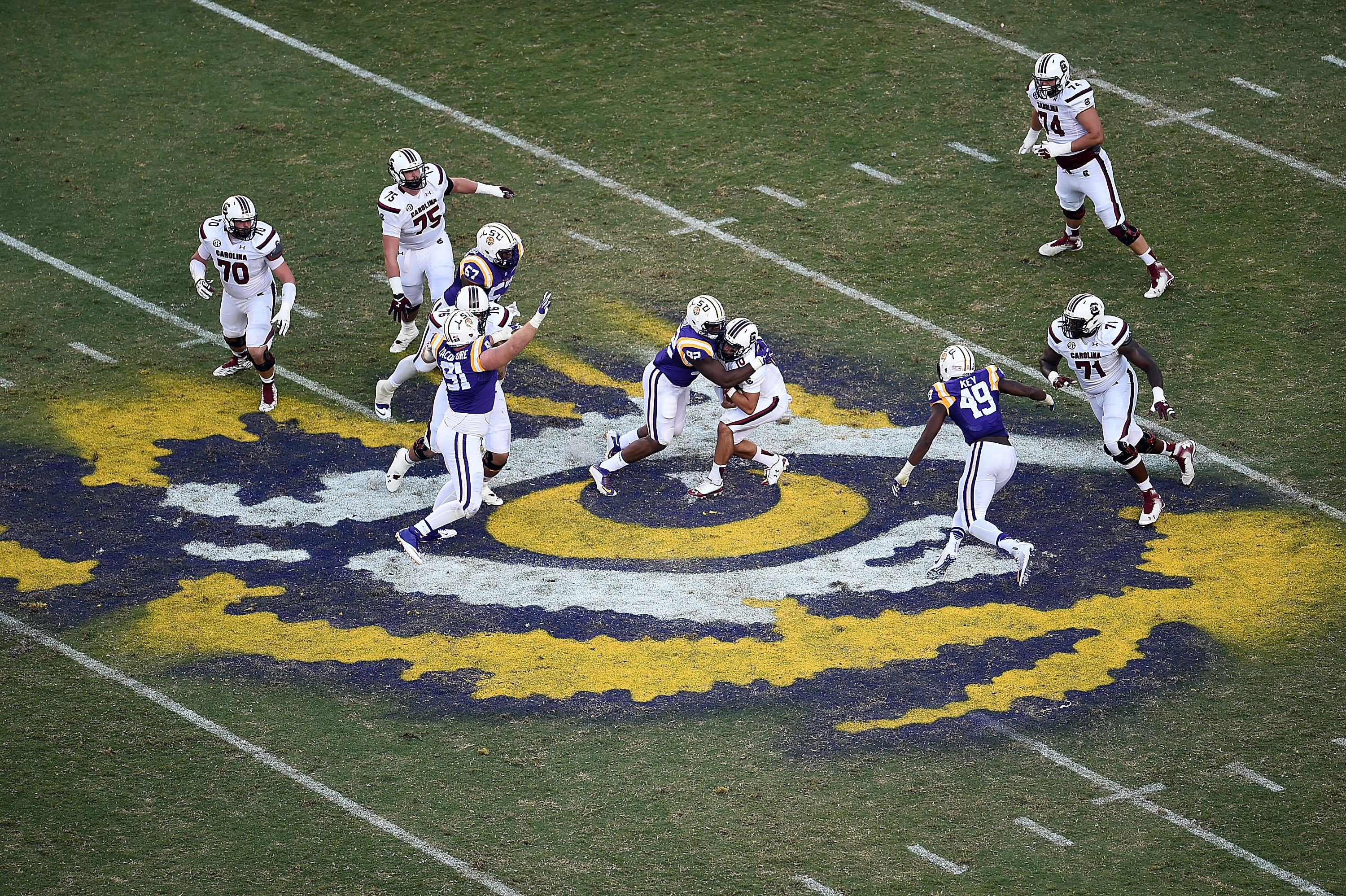 BATON ROUGE, LA - OCTOBER 10: Perry Orth #10 of the South Carolina Gamecocks is sacked by Lewis Neal #92 of the LSU Tigers during the fourth quarter of a game at Tiger Stadium on October 10, 2015 in Baton Rouge, Louisiana. (Photo by Stacy Revere/Getty Images)