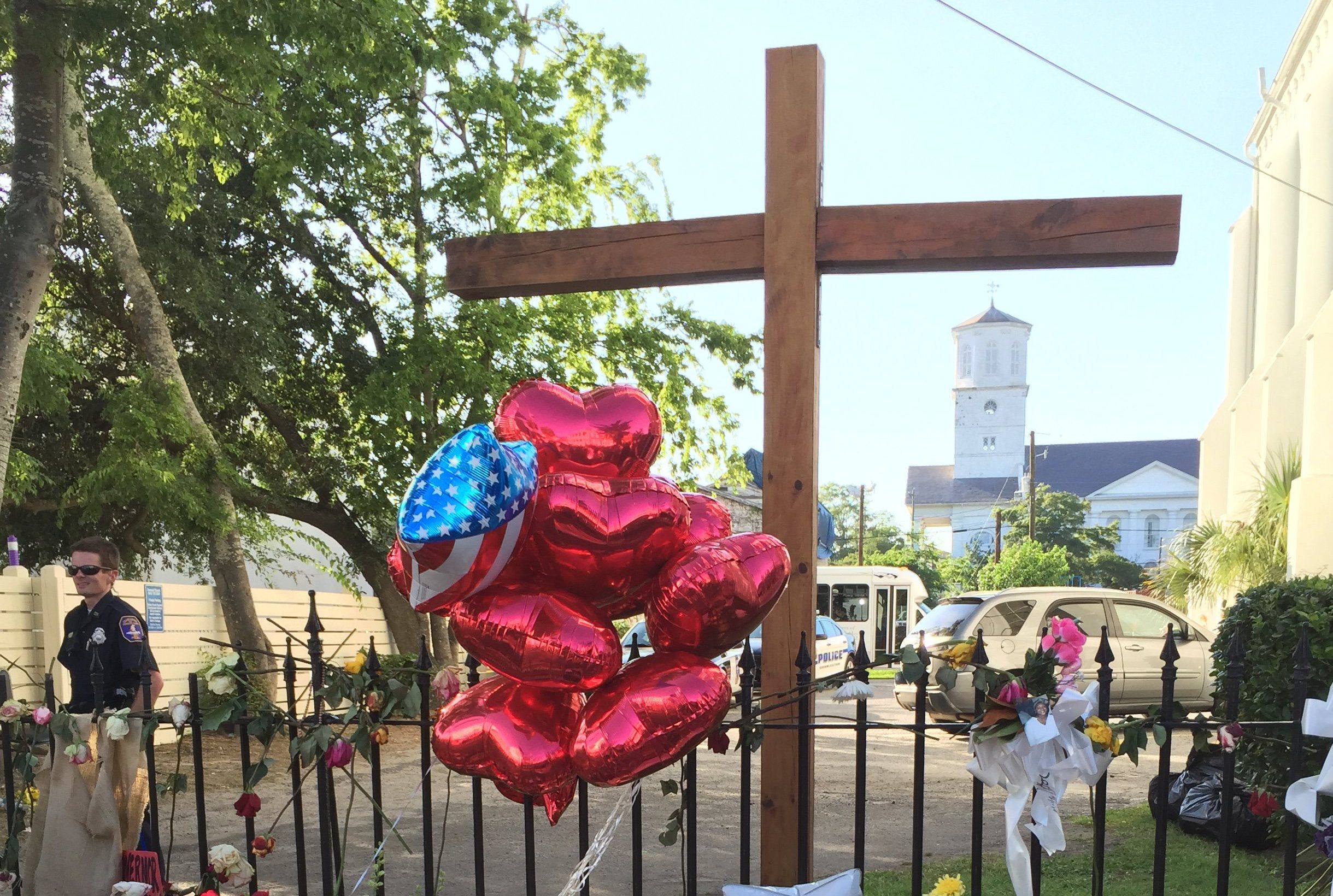 Flowers, including a wedding bouquet, are placed outside Emanuel African Methodist Episcopal Church on Sunday, June 21, 2015. (CNN)