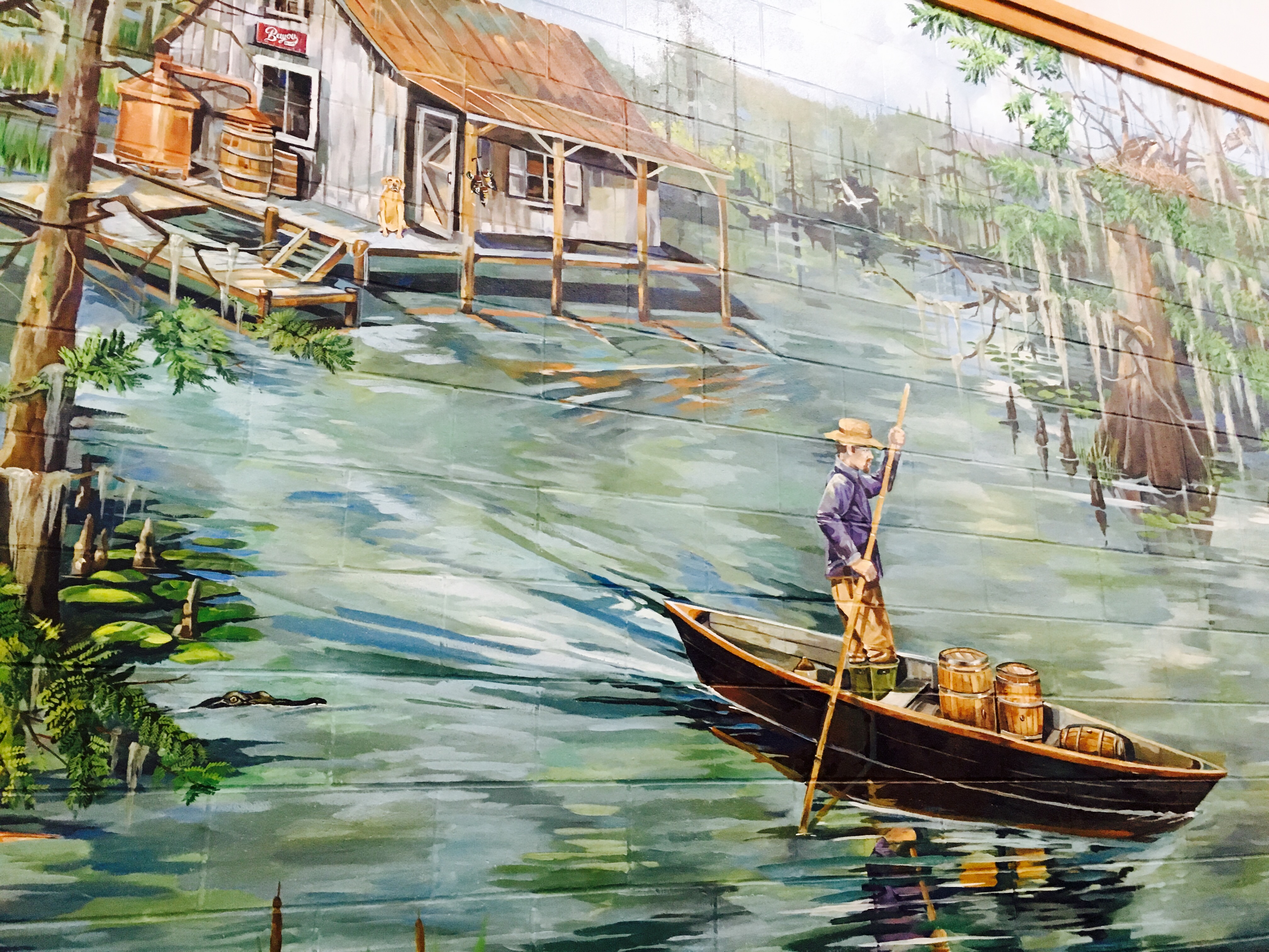 This colorful mural adorns the wall inside Louisiana Spirits, the distillery where Bayou Rum is made.