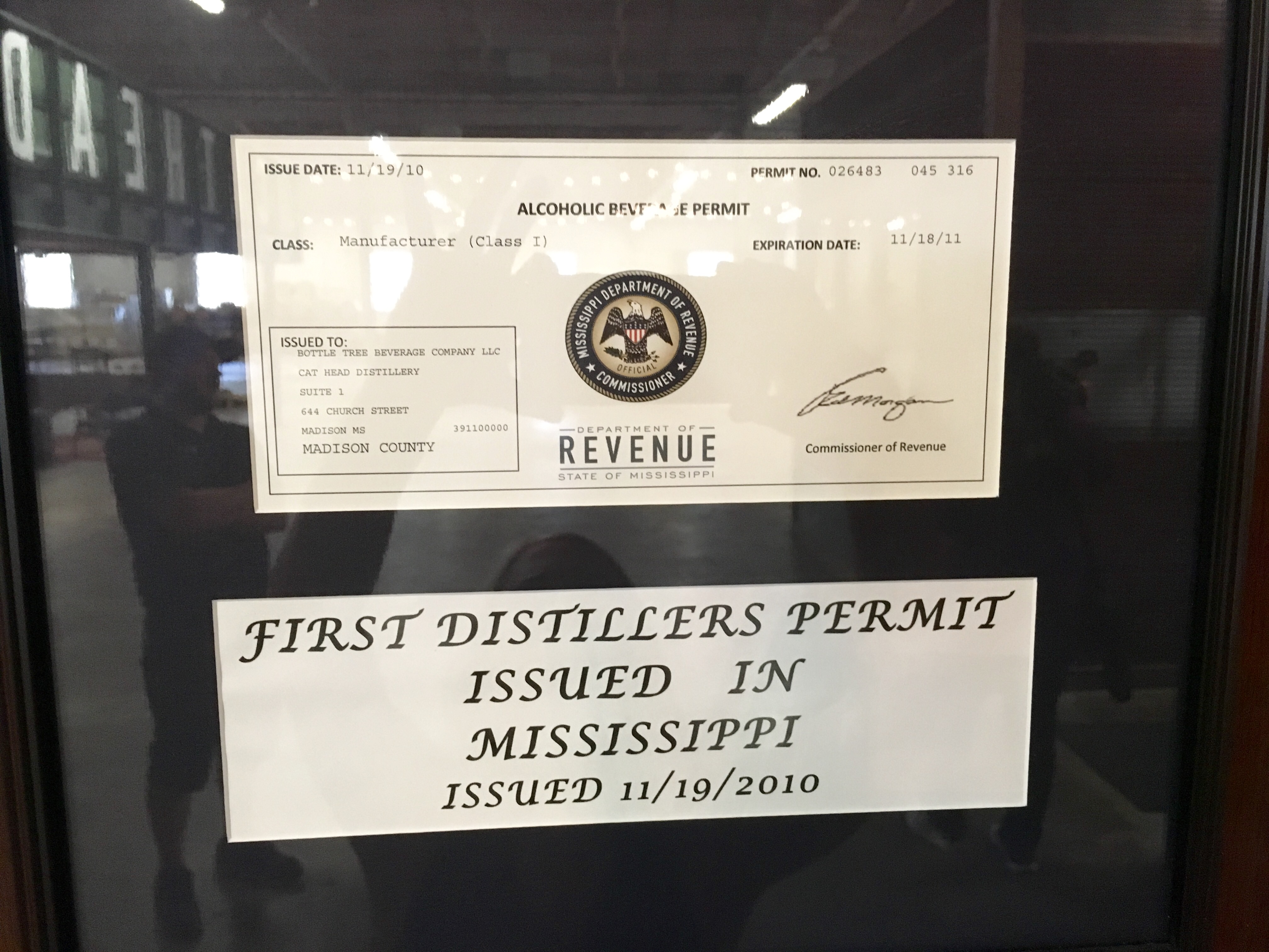 Mississippi's first distiller's permit hangs on the wall at Cathead.