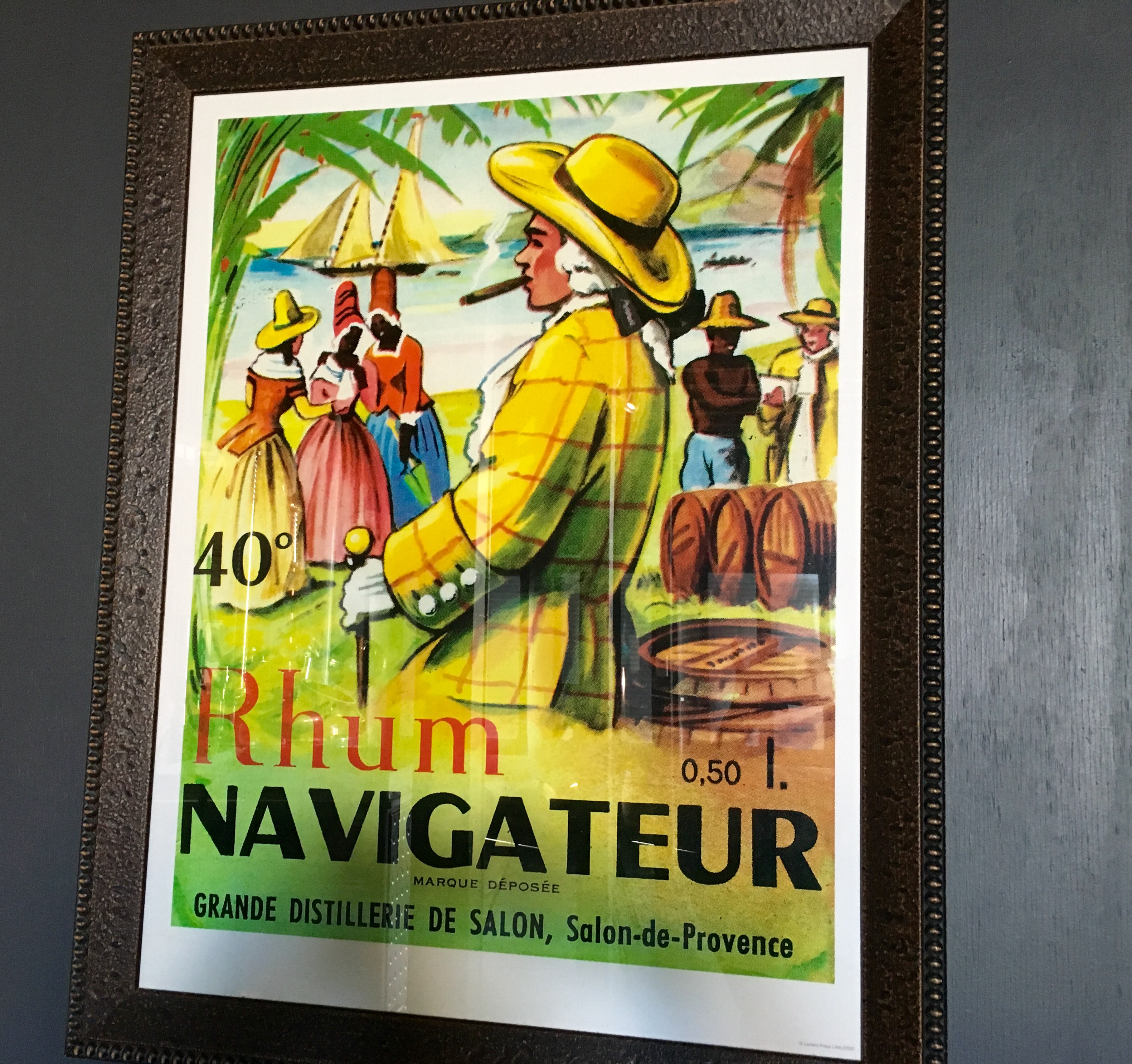 Colorful poster on the wall at Charboneau Distillery.