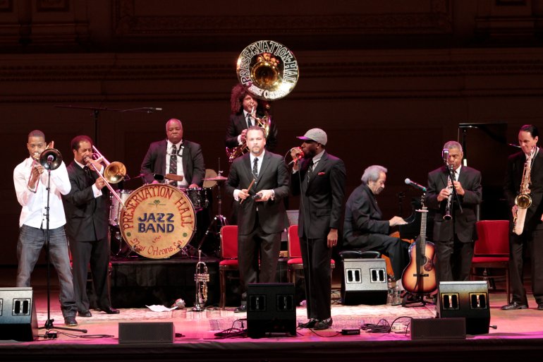 NEW YORK, NY - JANUARY 07: Mos Def (C) performs with The Preservation Hall Jazz Band during the Preservation Hall Jazz Band 50th anniversary at Carnegie Hall on January 7, 2012 in New York City. (Photo by Cory Schwartz/Getty Images)