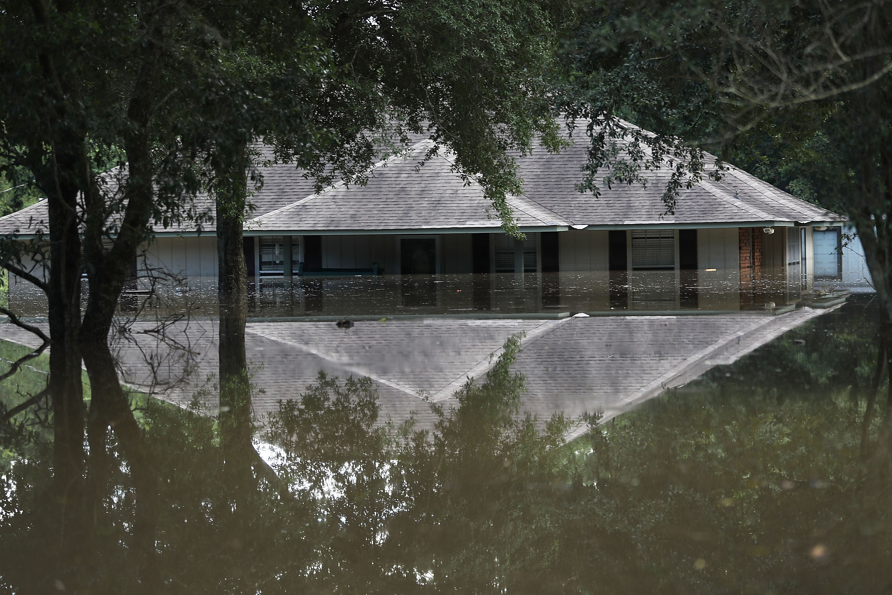BATON ROUGE, LA - AUGUST 15: A flooded home is seen on August 15, 2016 in Baton Rouge, Louisiana. Record-breaking rains pelted Louisiana over the weekend leaving the city with historic levels of flooding that have caused at least seven deaths and damaged thousands of homes. (Photo by Joe Raedle/Getty Images)