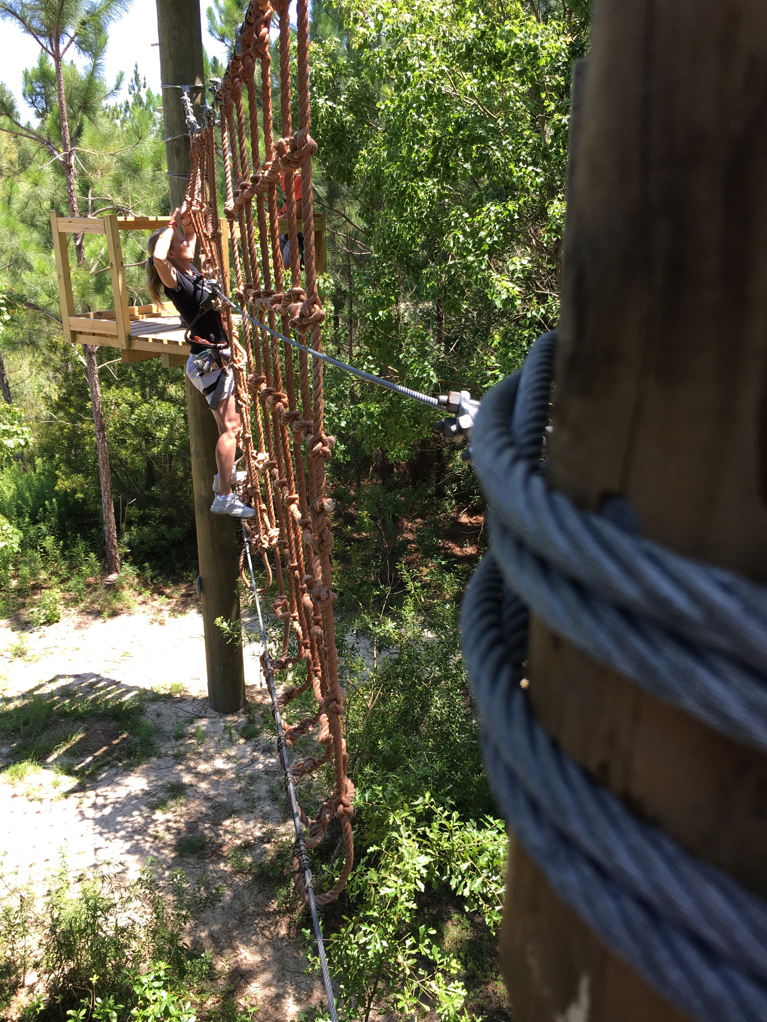 Swinging into a rope wall is a frightening challenge for some.