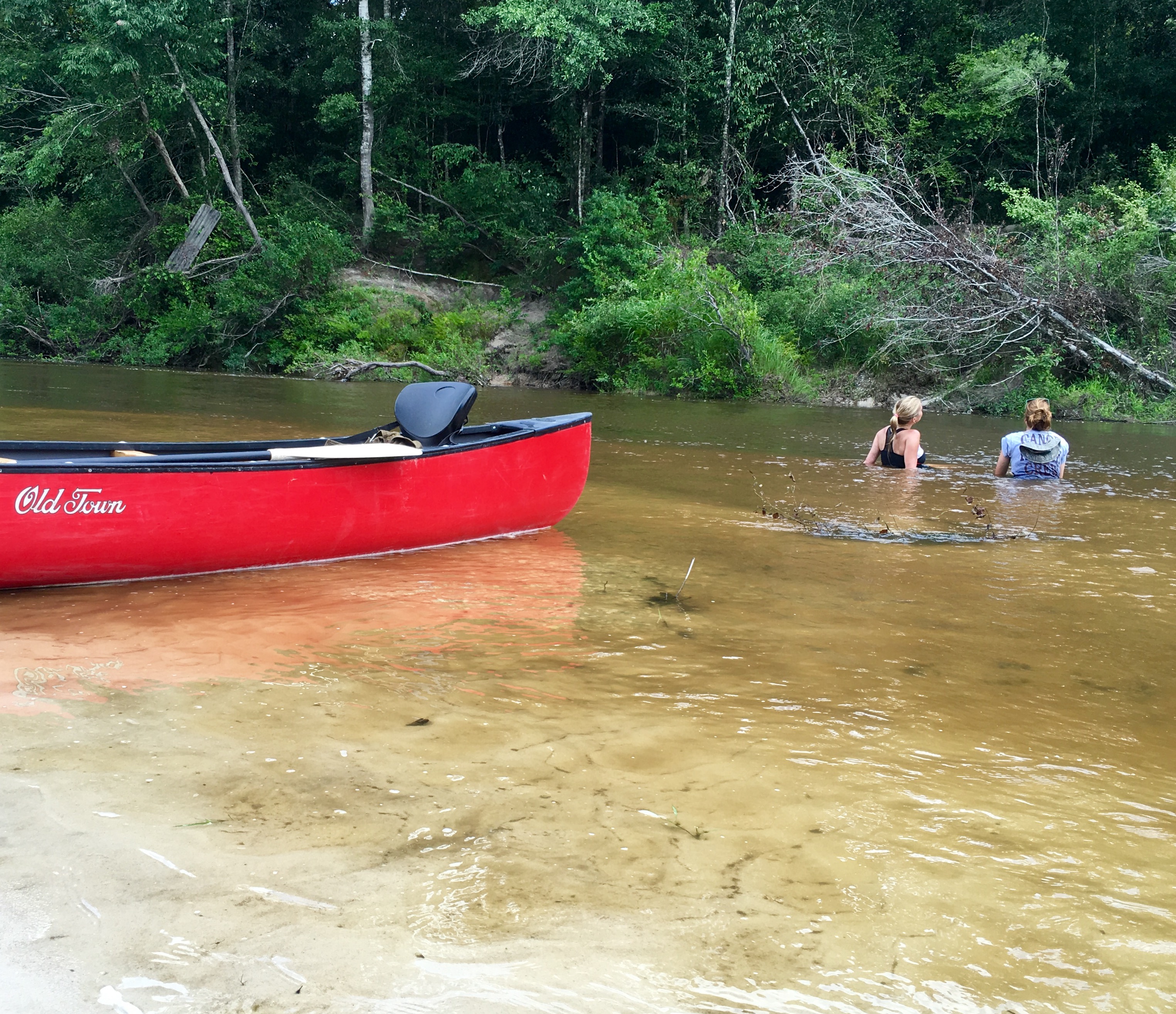 WGNO Travel Girl Stephanie Oswald and guide Joanna Dorris cooling off in the Wolf River.