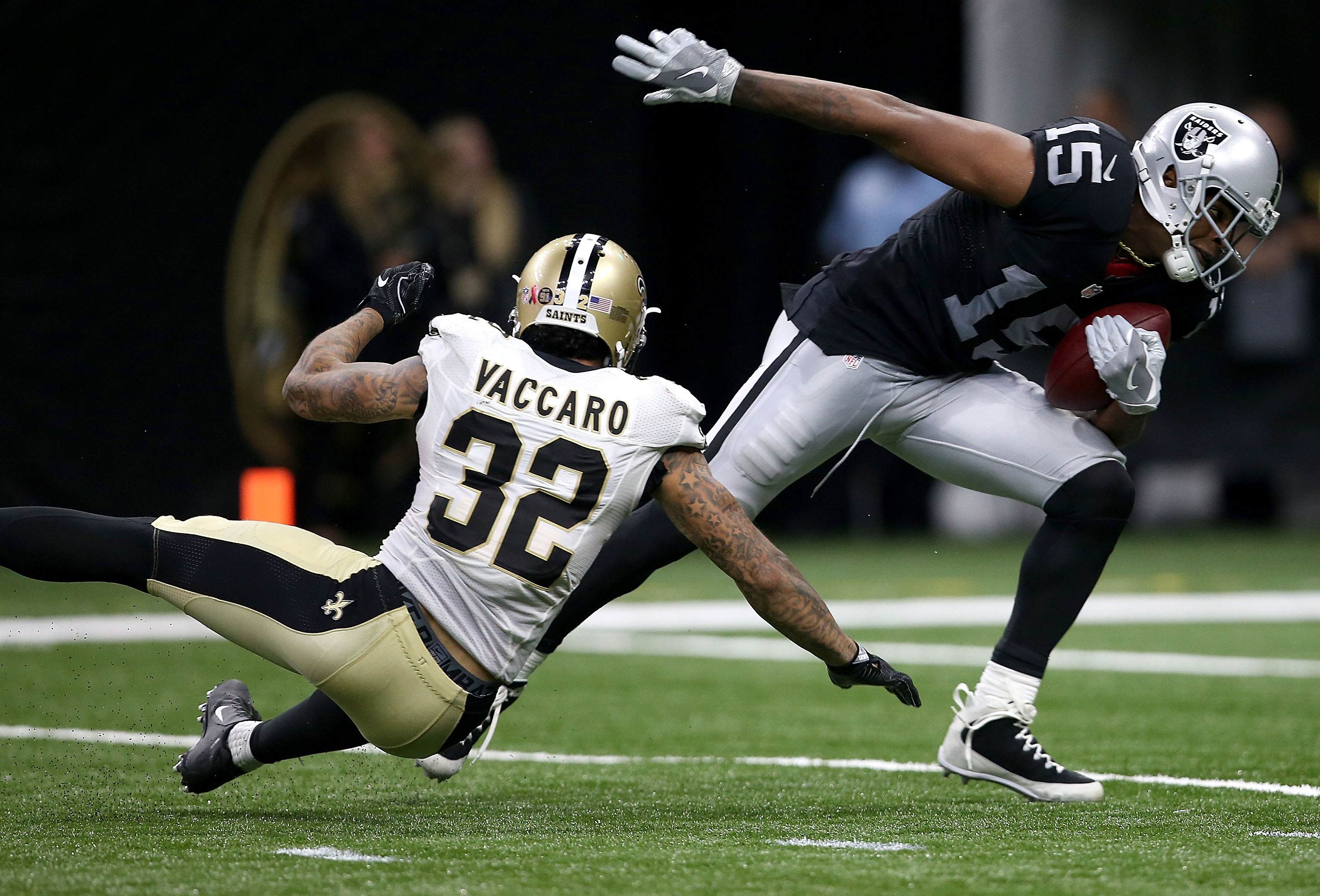 NEW ORLEANS, LA - SEPTEMBER 11: Michael Crabtree #15 of the Oakland Raiders runs past Kenny Vaccaro #32 of the New Orleans Saints druing the second quarter at the Mercedes-Benz Superdome on September 11, 2016 in New Orleans, Louisiana. (Photo by Sean Gardner/Getty Images)