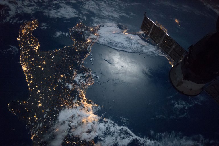 Moon's Reflection off of the Italian Peninsula and the Mediterranean Sea Courtesy: NASA.gov