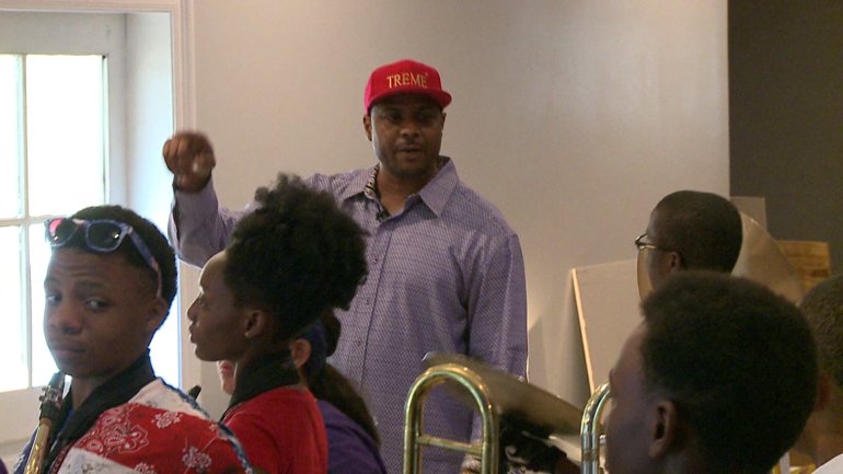 Roots of Music co-founder Derrick Tabb and students (WGNO-TV)