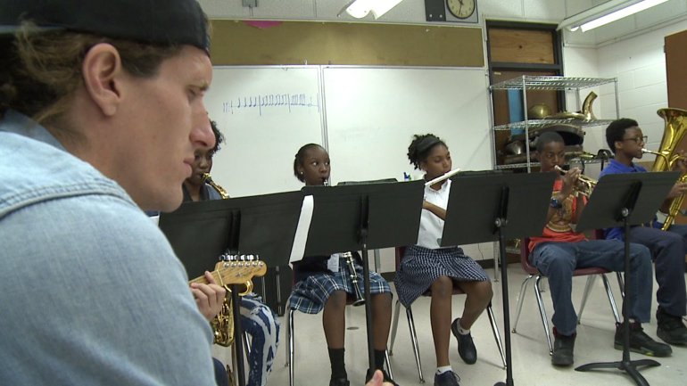 Revivalist Singer David Shaw and students of the Roots of Music (WGNO-TV)