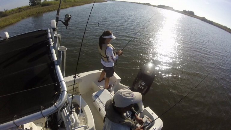 Martha Spencer and LBJ catching fish (WGNO-TV)