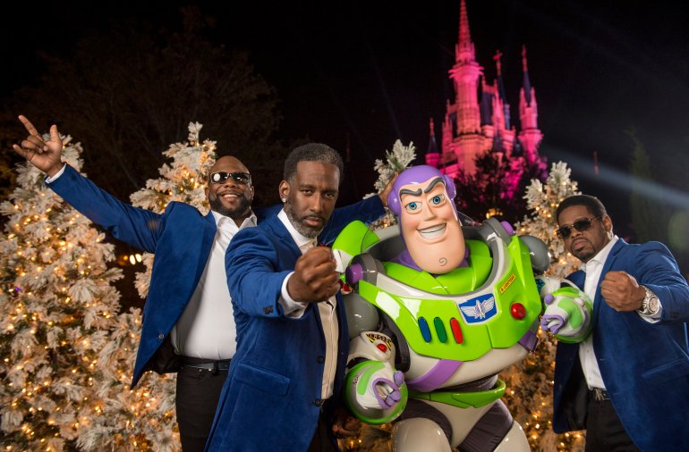 LAKE BUENA VISTA, FL - NOVEMBER 09: In this handout photo provided by Disney Parks, (L-R) Wanya Morris, Shawn Stockman and Nathan Morris of R&B group Boyz II Men pose with Buzz Lightyear during a break from taping of the Thanksgiving TV special, "The Wonderful World of Disney: Magical Holiday Celebration", in Magic Kingdom Park at Walt Disney World Resort on November 9, 2016 in Lake Buena Vista, Florida. The telecast airs nationwide November 24 on ABC-TV. (Photo by Kent Phillips/Disney Parks via Getty Images)