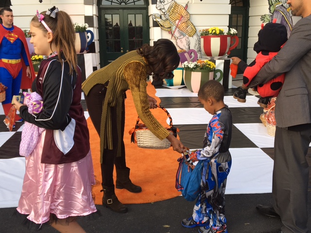 Robeson "Roby" Perry gets Halloween treats from First Lady Michelle Obama on October 31, 2016 (photo credit Dr. Andre Perry)