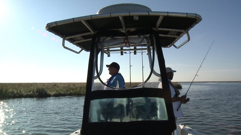 St. Bernard Parish President Guy McInnis and LBJ fishing in Delacroix, La. (WGNO-TV)