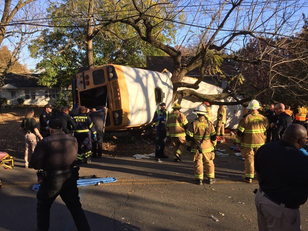 Medics rushed nearly two dozen people to hospitals in Chattanooga on Monday after a school bus crashed in the Tennessee city, officials said. The bus appears to have slammed into a tree and looks like it was split apart.