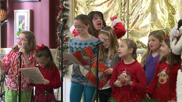 Kid's sing at the Vince Vance Holiday Kids Sing-A-Long & Dance Party at Deanie's in the French Quarter (WGNO-TV) 