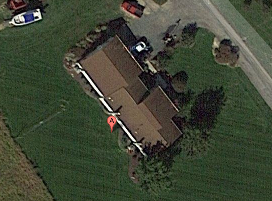 This Google image shows the actual address where Packanywere says it is located.  It is an abandoned farm.