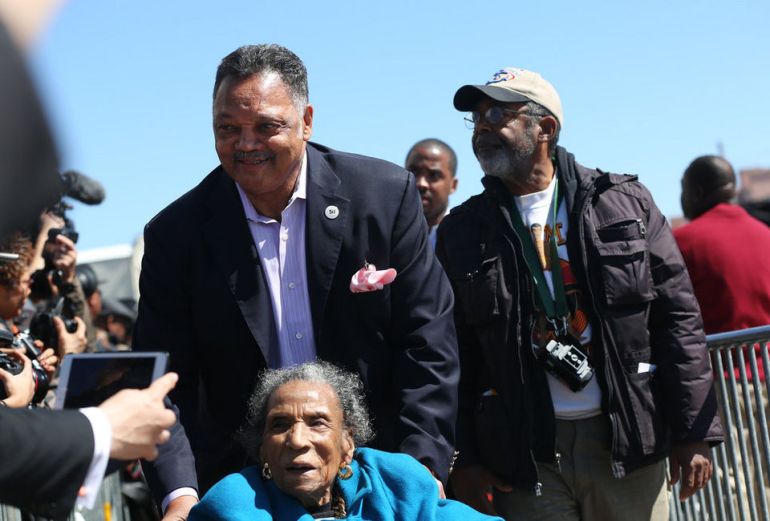 Jesse Jackson arrives in Selma, Ala., with civil rights activist Amelia Boynton Robinson as thousands crowded into downtown Selma, Ala., to hear President Obama speak on the 50th anniversary of Bloody Sunday on Saturday March 7, 2015. Robinson was beaten unconscious on Bloody Sunday on March 7, 1965. (Sharon Steinmann/ssteinmann@al.com)
