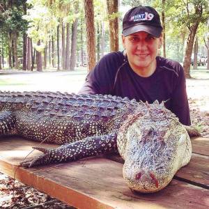 Denise Vickers with the gator she harvested in Alabama's 2015 hunt.
