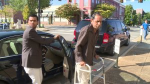 Chirag Patel, left, helps his father, Sureshbhai Patel out of the car before court began Monday morning. (David Schmidt/WHNT News 19)