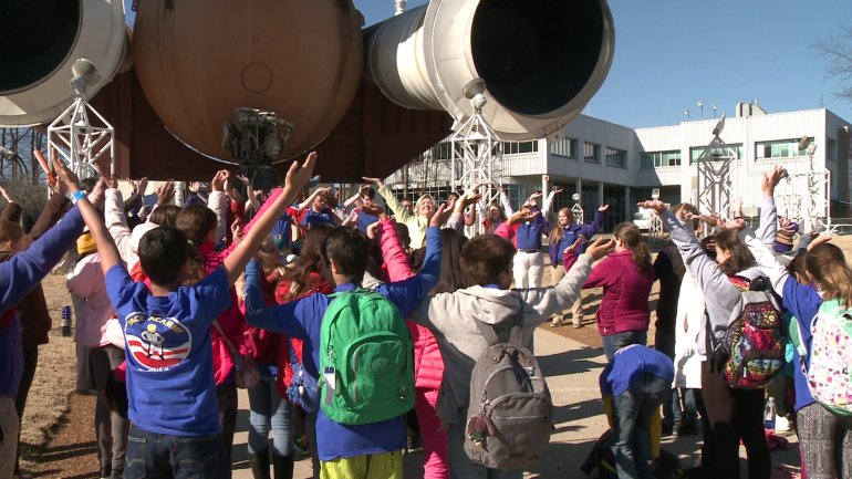 Space Camp students stretch their arms in the form of wings to honor the Challenger astronauts. (Photo: Chris Davis/WHNT News 19)