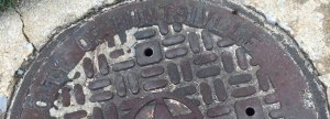 'Huntsville' is misspelled in this manhole cover in front of WHNT News 19 on Holmes Avenue.