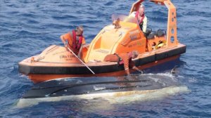 Crews work to bring in the boat belonging to Stephanos and Perry